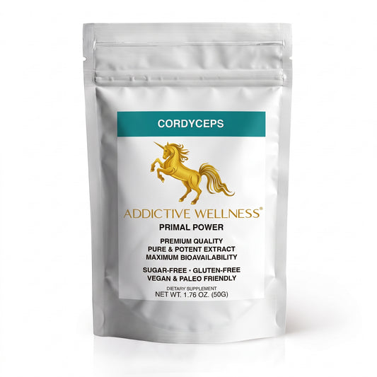 A silver stand-up pouch of Addictive Wellness Cordyceps Primal Power dietary supplement, featuring a teal label and a gold unicorn logo on a white background.