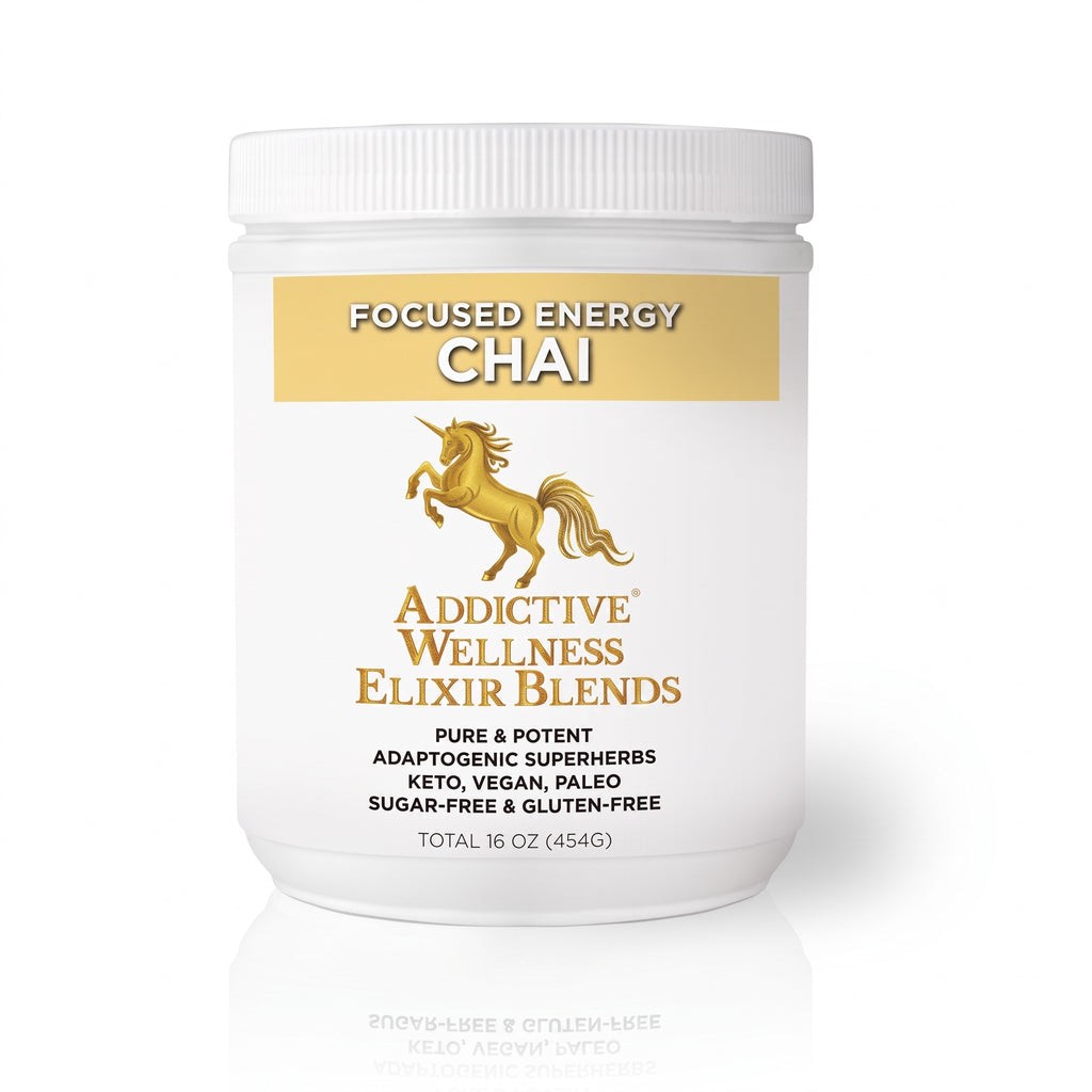 A white plastic tub of Addictive Wellness Elixir Blends Focused Energy Chai, featuring a white and gold label with a gold unicorn illustration, set against a clean white background with a subtle reflection.