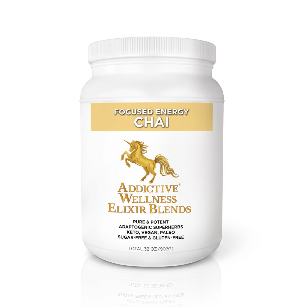 A white plastic supplement tub labeled 'Focused Energy Chai' by Addictive Wellness Elixir Blends, featuring a gold unicorn logo and text, on a white background with a soft reflection below.