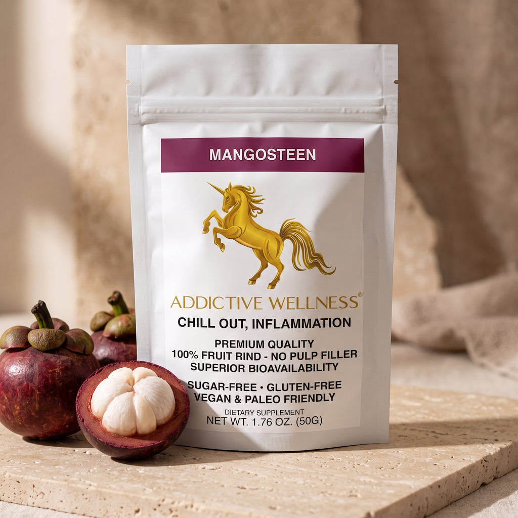 A white stand-up pouch of Addictive Wellness Mangosteen dietary supplement, styled on a stone surface with fresh mangosteen fruits in the foreground against a warm beige background.