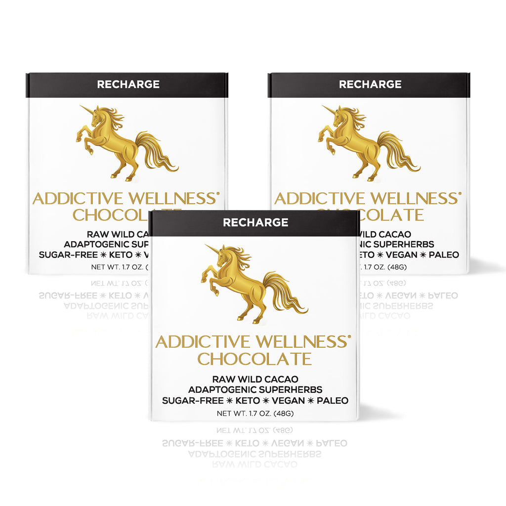 Three packages of Addictive Wellness Chocolate with a gold unicorn logo on a white background.