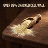 Fine pine pollen powder poured from a wooden scoop, over 99% cracked cell wall
