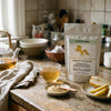 Addictive Wellness Gynostemma pouch with a glass cup of gynostemma tea