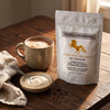 Addictive Wellness Tremella Mushroom pouch beside a creamy latte and a dish of cream-colored tremella powder