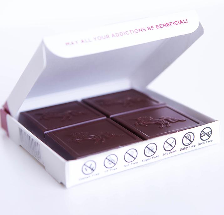Open box with a bar of chocolate inside